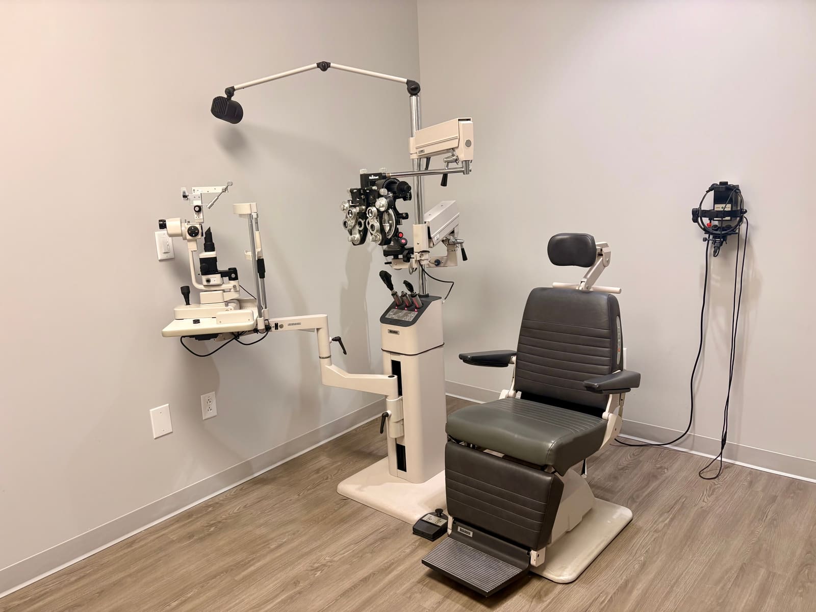 Exam room at Fort Jackson Eye Center with an exam chair, phoropter, and slit lamp